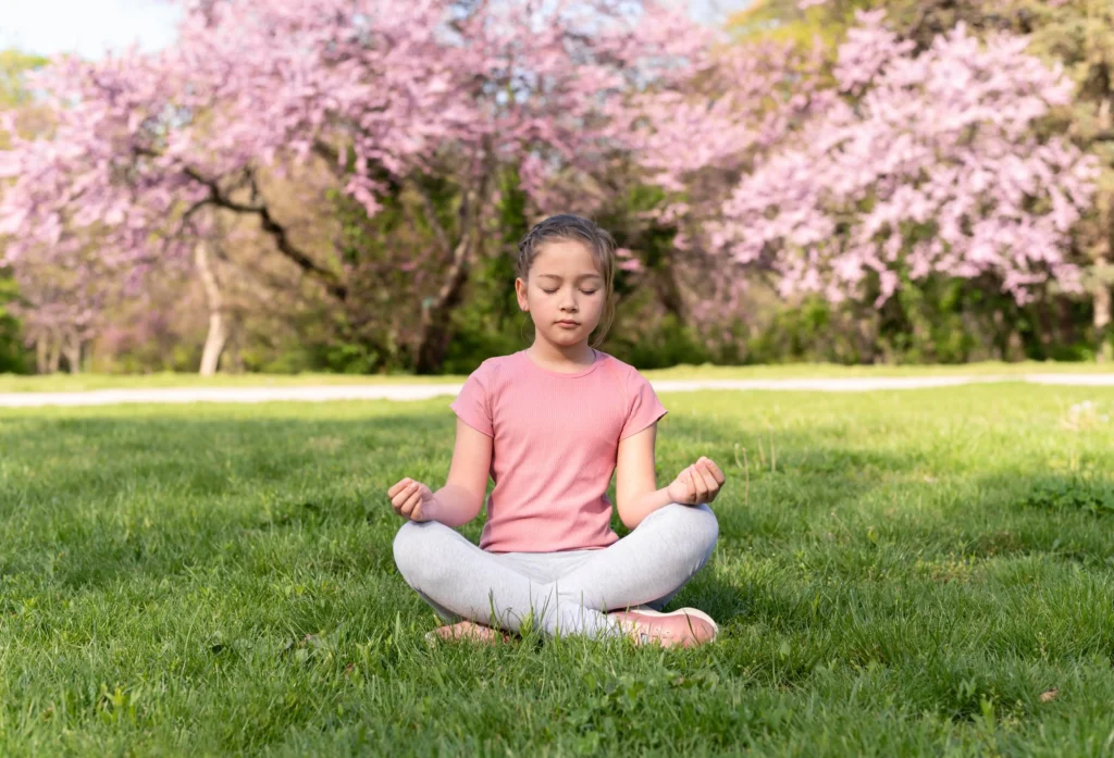 Kids practicing yoga poses in a calm classroom