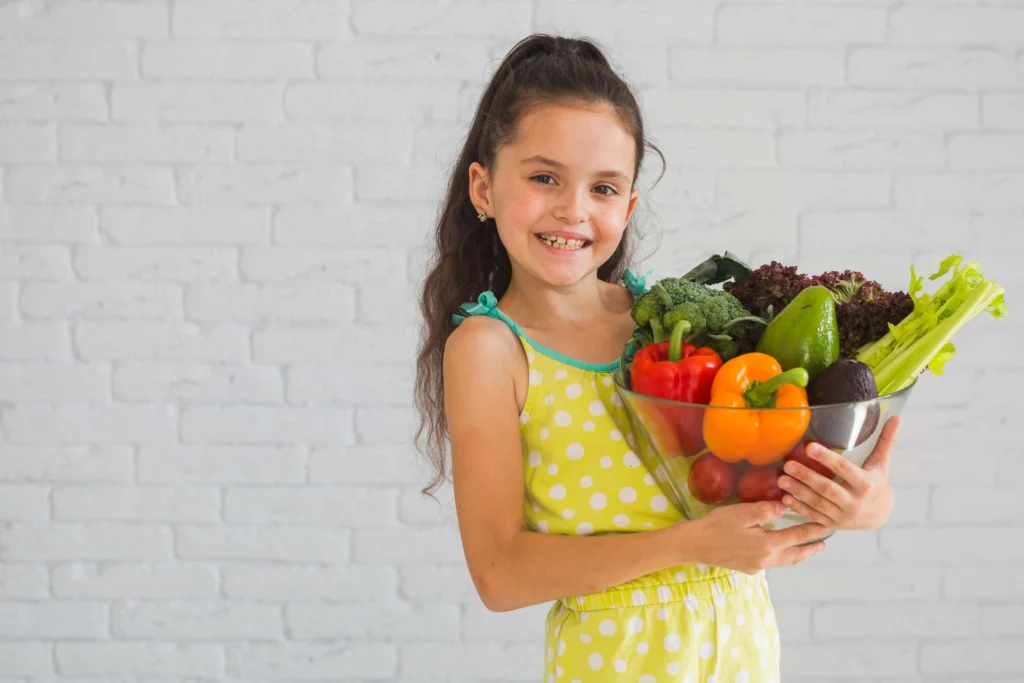 Kids eating colorful rainbow vegetables